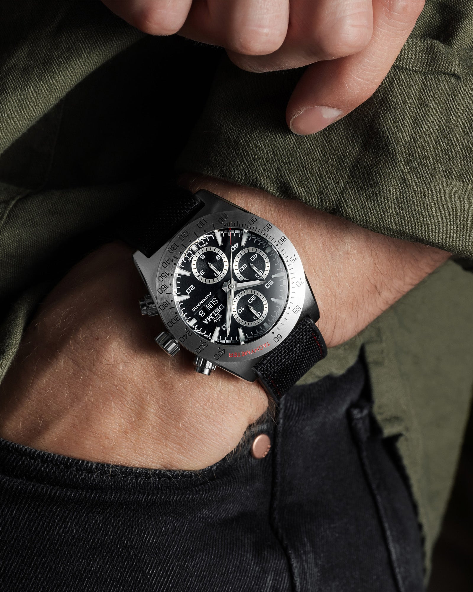 DELMA Montego stainless steel watch with black dial and black Cordura strap on wrist