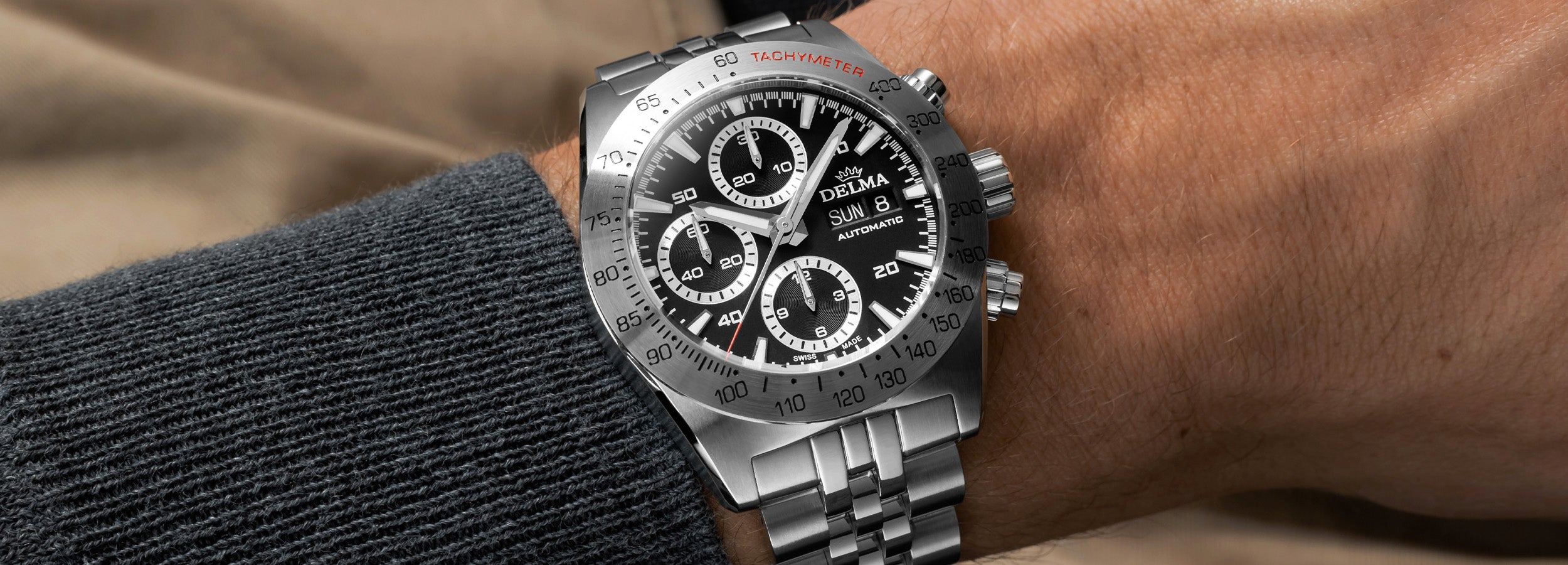 DELMA Montego stainless steel watch with black dial on wrist