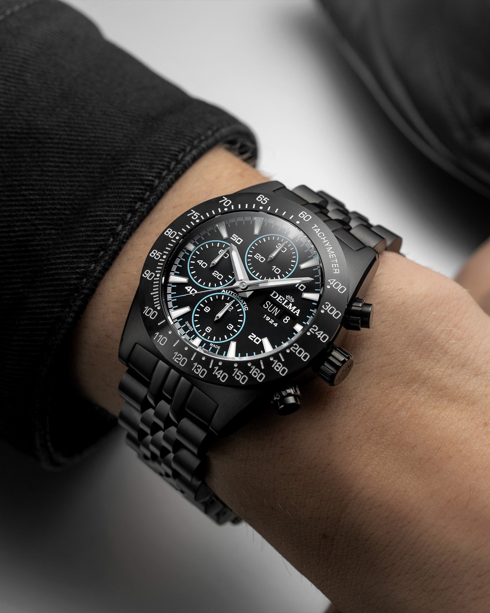 DELMA Montego Black Edition stainless steel watch with black DLC and black dial with blue accents wrist shot