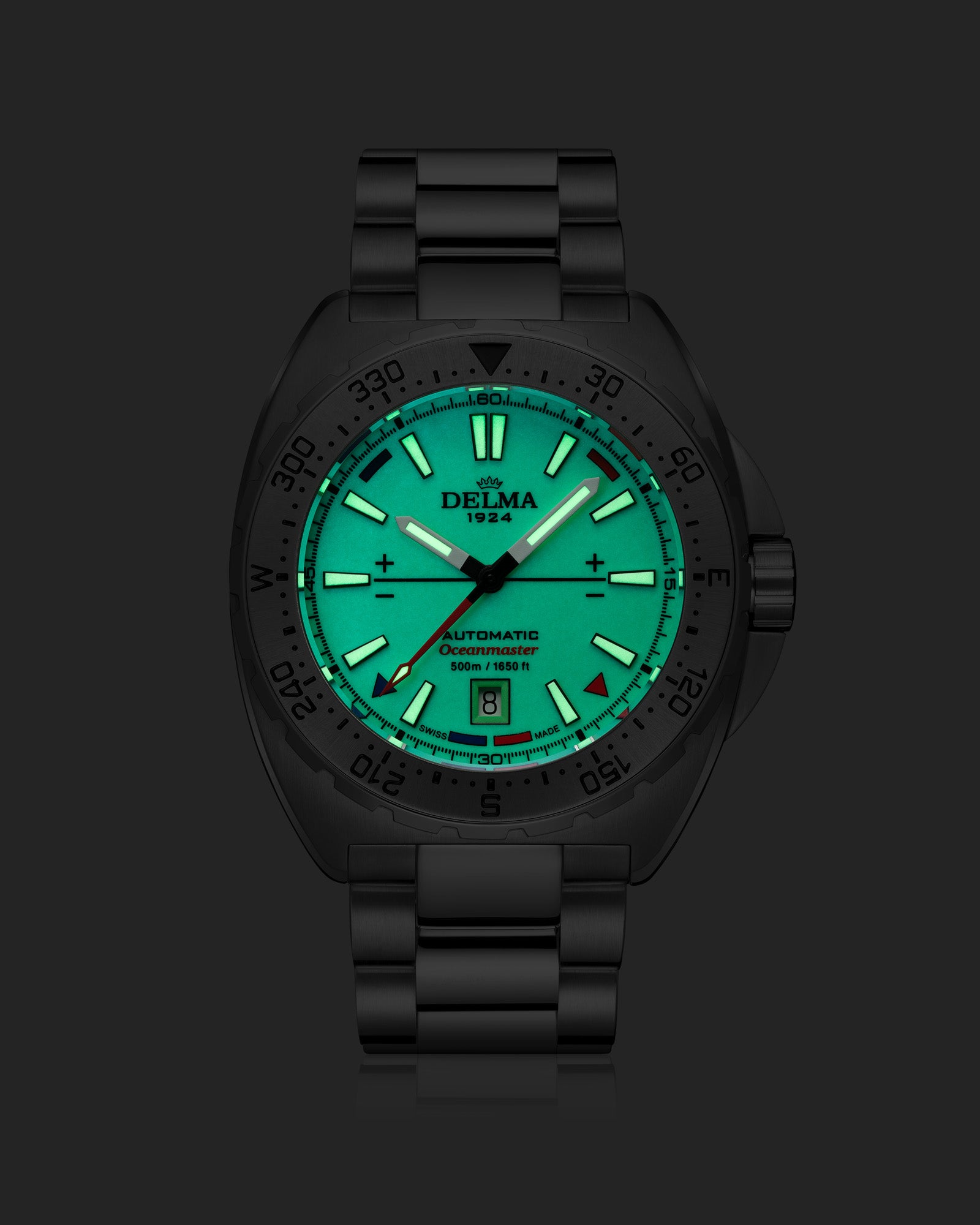 DELMA Oceanmaster Lume stainless steel watch with green luminous dial night