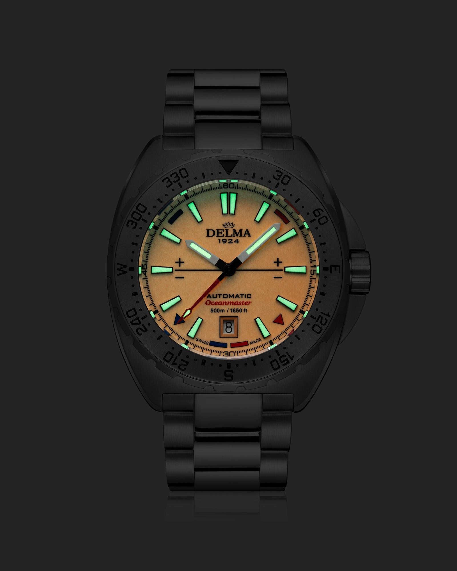 DELMA Oceanmaster Lume in stainless steel with orange dial night