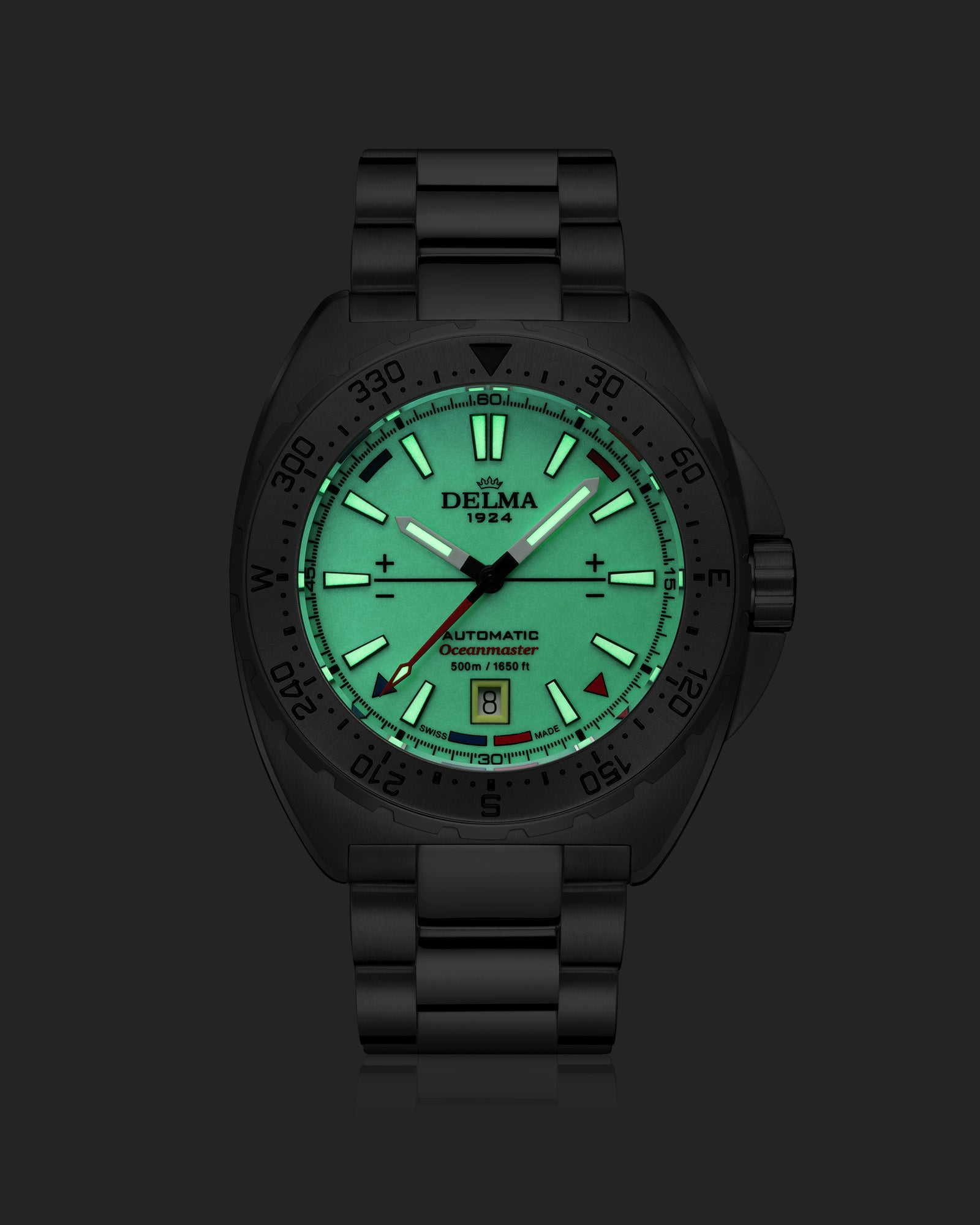 DELMA Oceanmaster Lume stainless steel watch with yellow luminous dial night