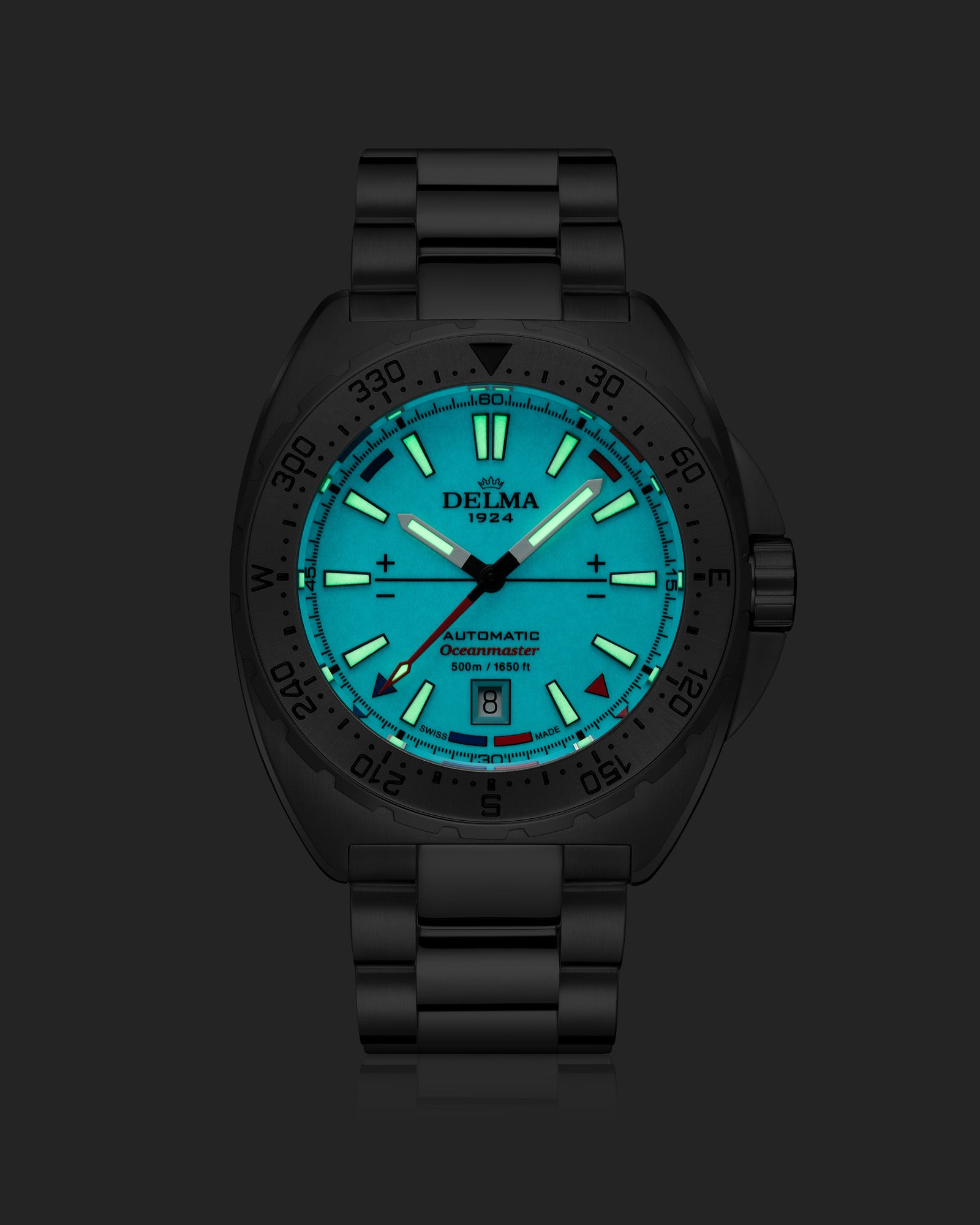 DELMA Oceanmaster Lume stainless steel watch with blue luminous dial night