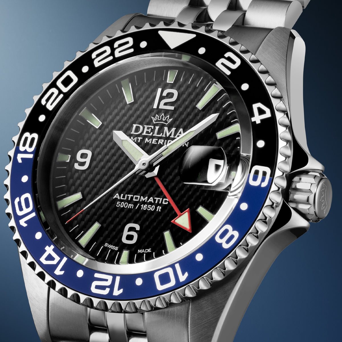 DELMA Santiago GMT Meridian Automatic stainless steel watch with black dial and black and blue bezel side close up