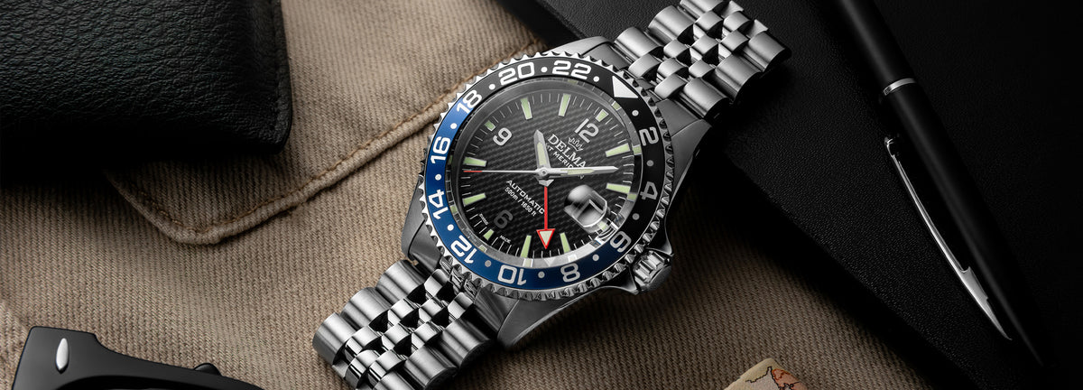 DELMA Santiago GMT Meridian Automatic stainless steel watch with black dial and black and blue bezel in context