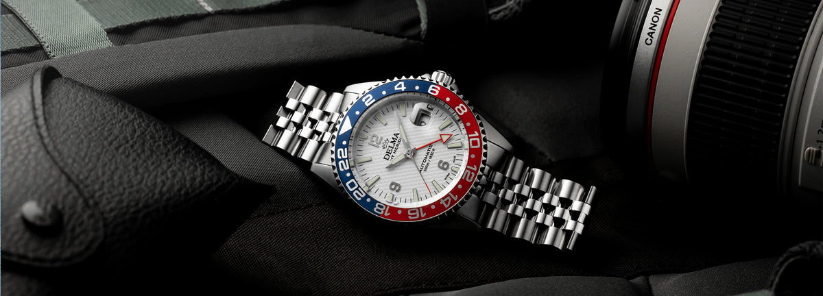 DELMA Santiago GMT Meridian Automatic stainless steel watch with white dial and blue and red bezel in context