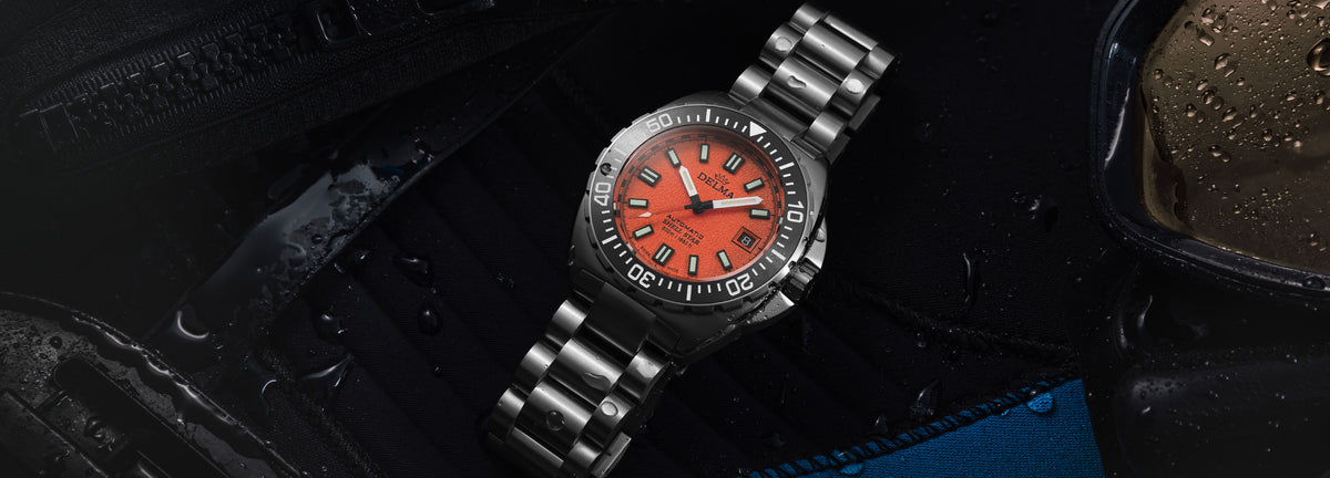 DELMA Shell Star Titanium watch with orange dial and black bezel in context