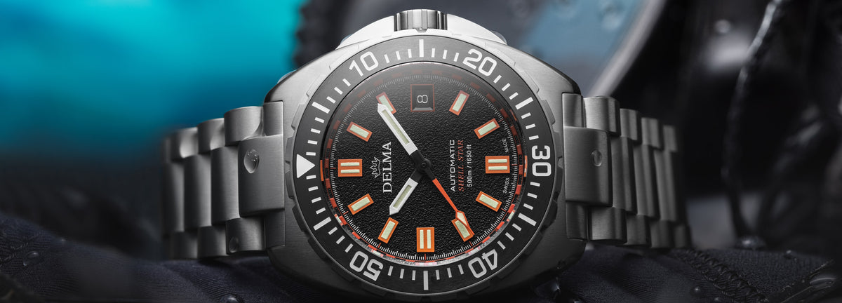 DELMA Shell Star Titanium watch with black dial and black bezel in context