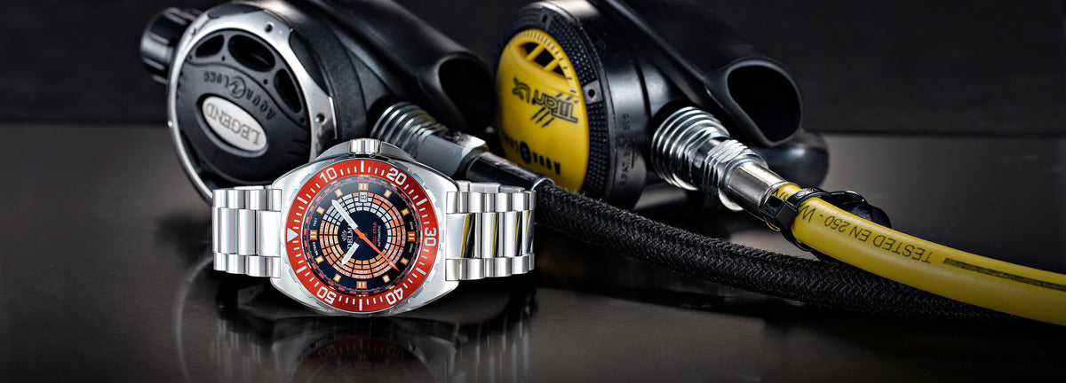 DELMA Shell Star Decompression Timer stainless steel watch with orange bezel in context